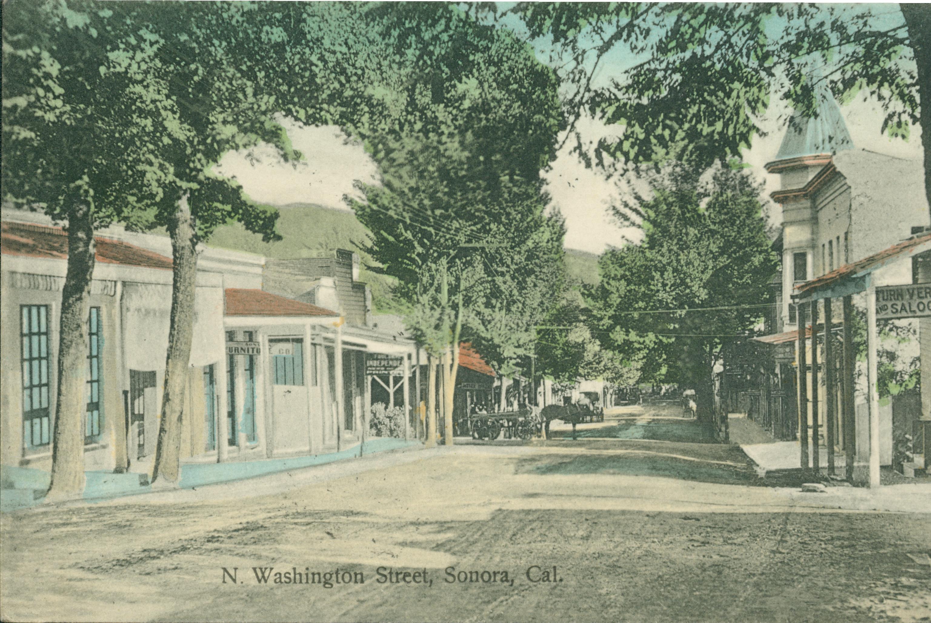 Shows Washington Street in Sonora lined with buildings and trees